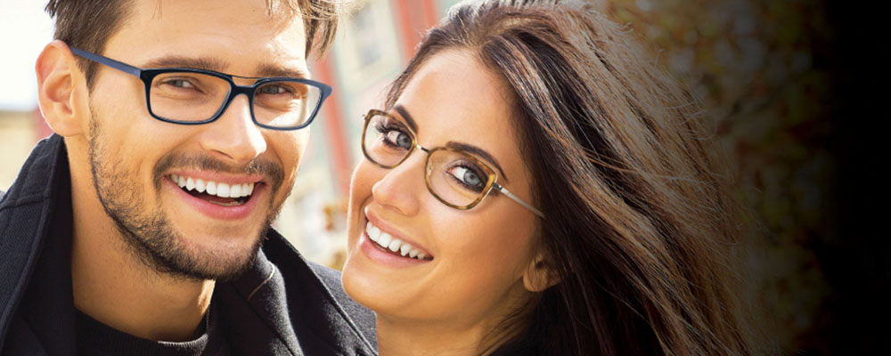 Two people wearing Helium Paris glasses