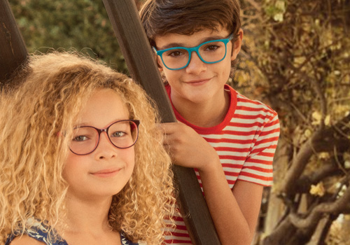 Designer kids' eyeglass frames and impact-resistant lenses
