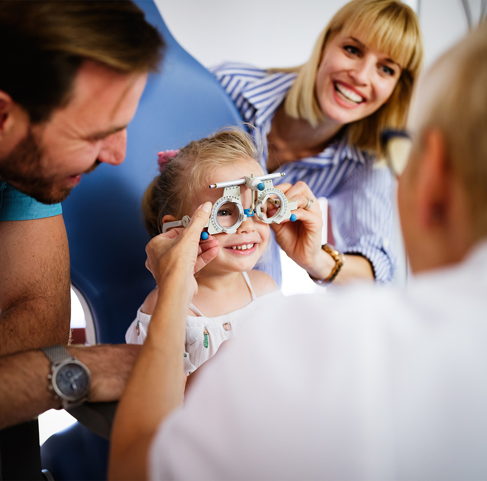 Pediatric eye doctor in the Chicago area giving an eye exam to a 5 year old child